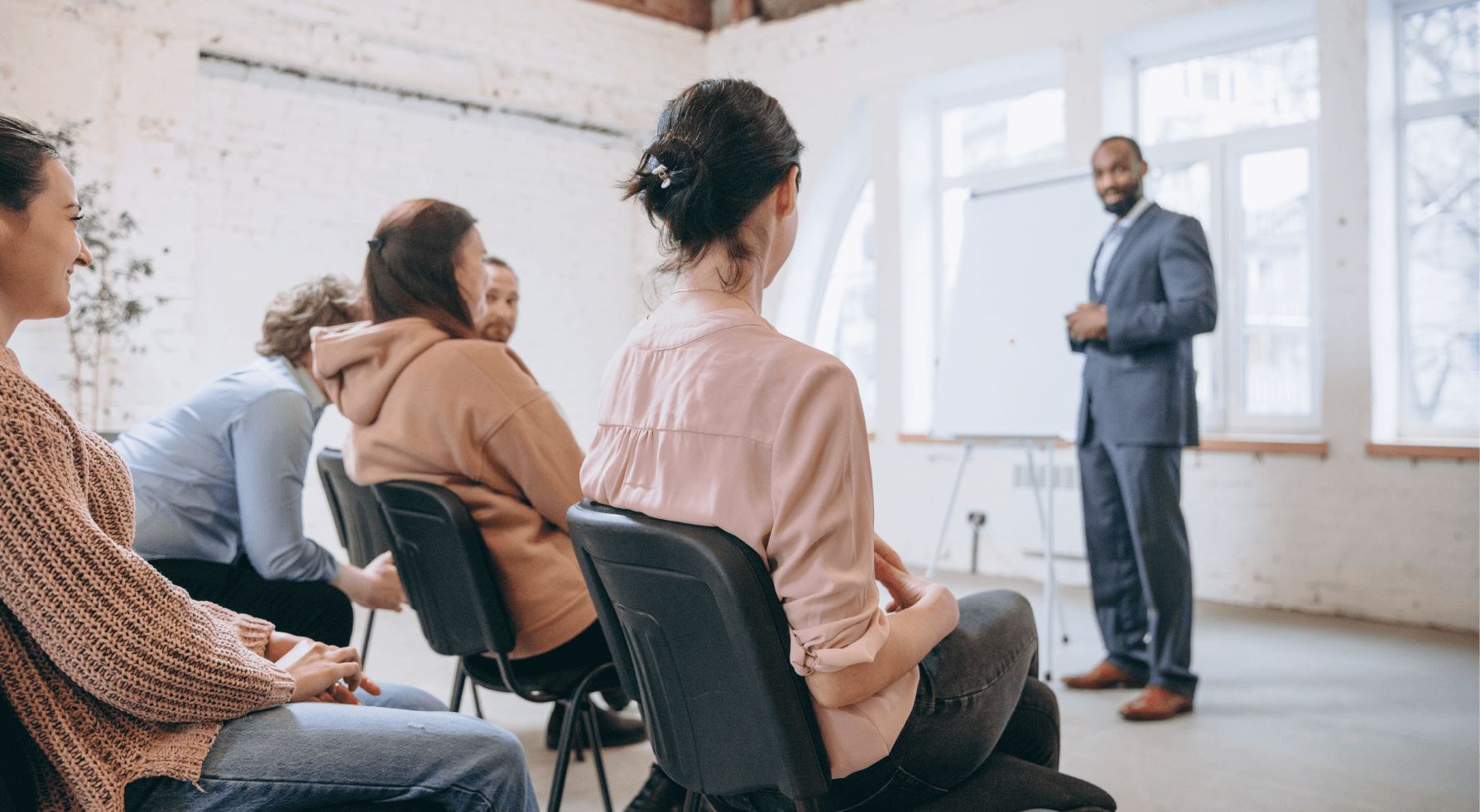 man leading a coaching session in the workplace